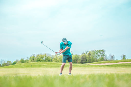 man in golf course playing