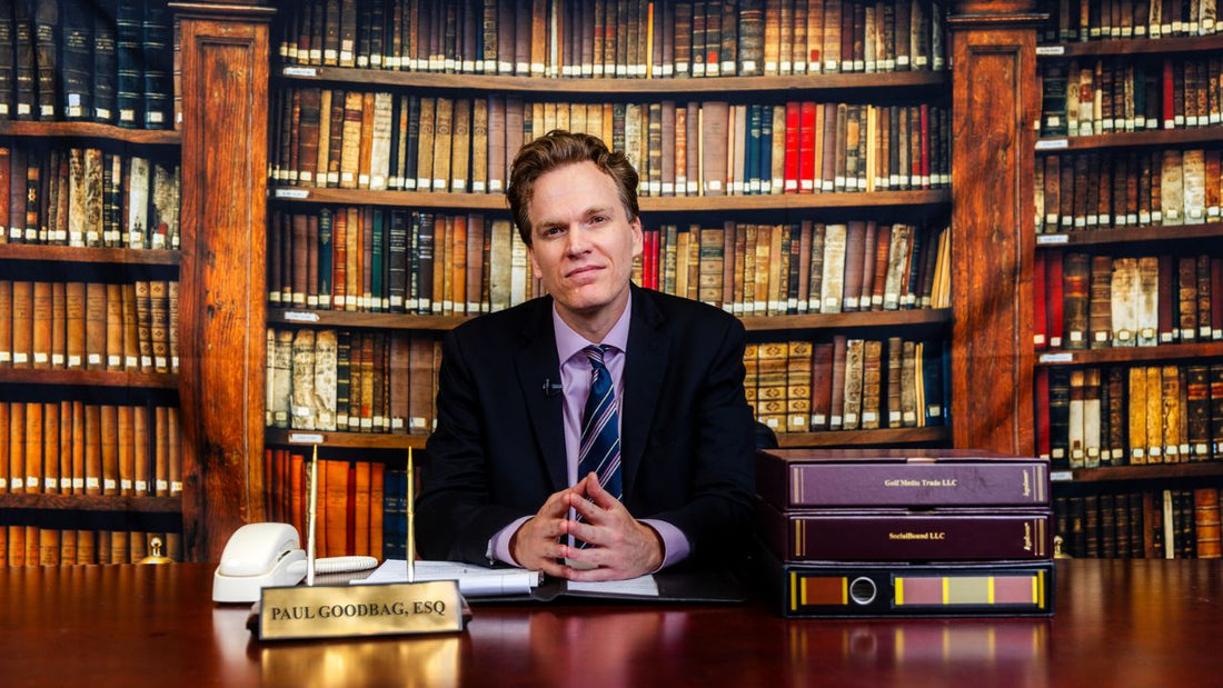 Man with several books behind him
