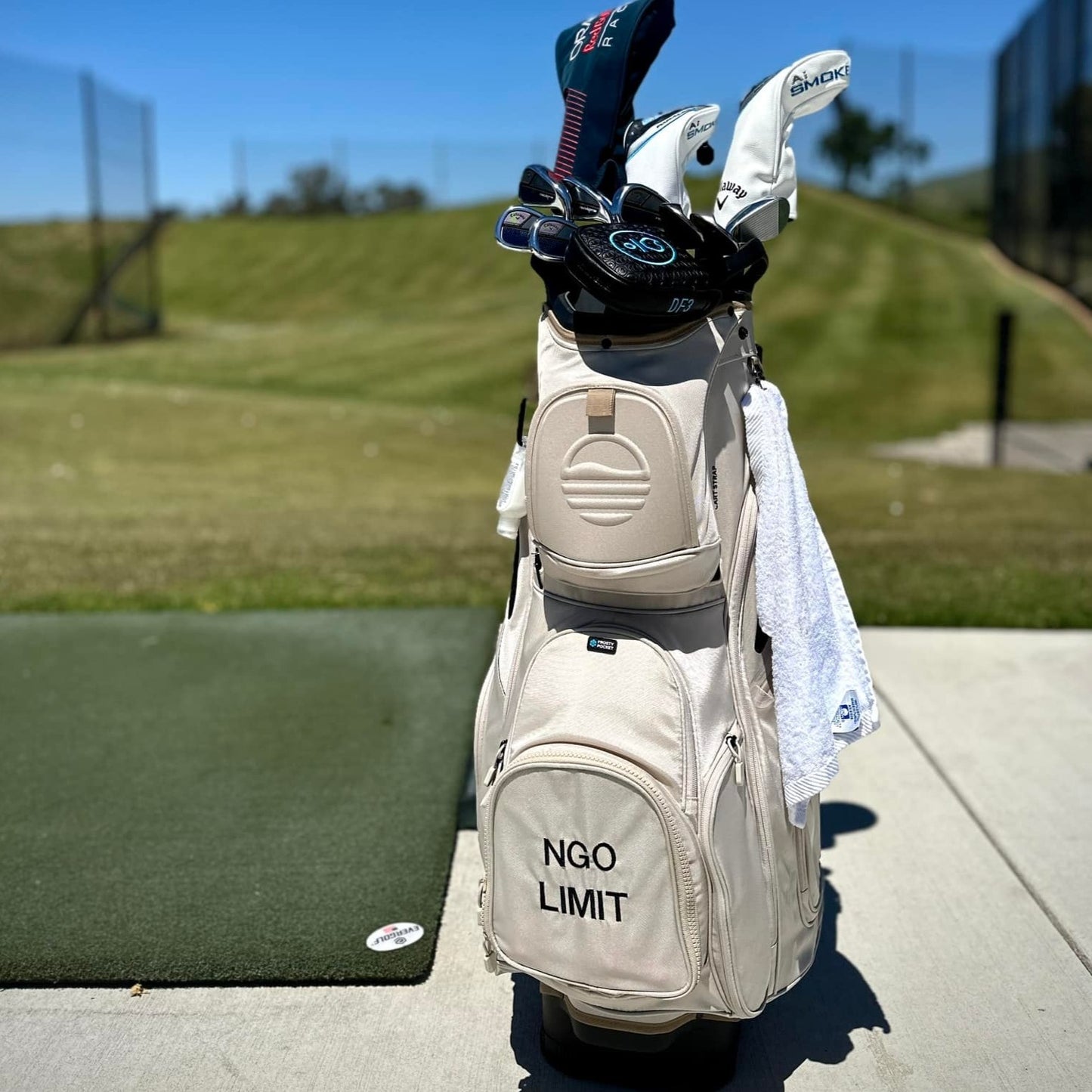 Toasted Almond Big Rig with embroidered pocket with some clubs and headcover