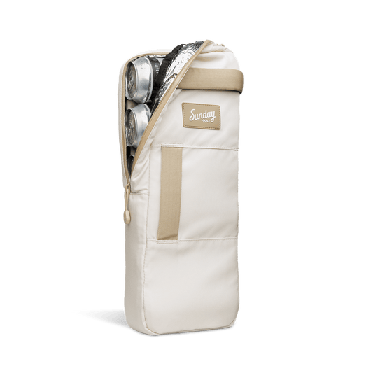 A front shot of big frosty golf cooler bag in toasted almond unzipped showing canned drinks inside