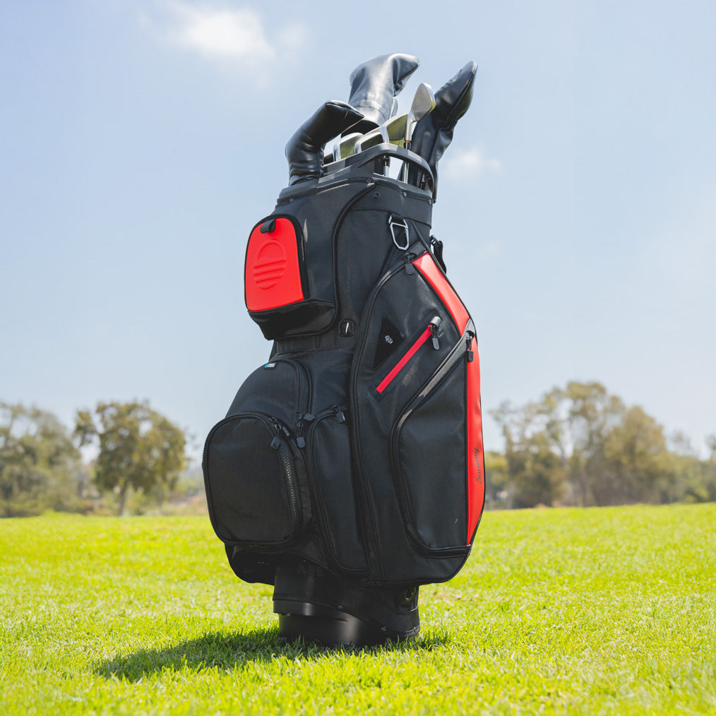 Big Rig golf bag in blackjack on a grassy field with trees in the background