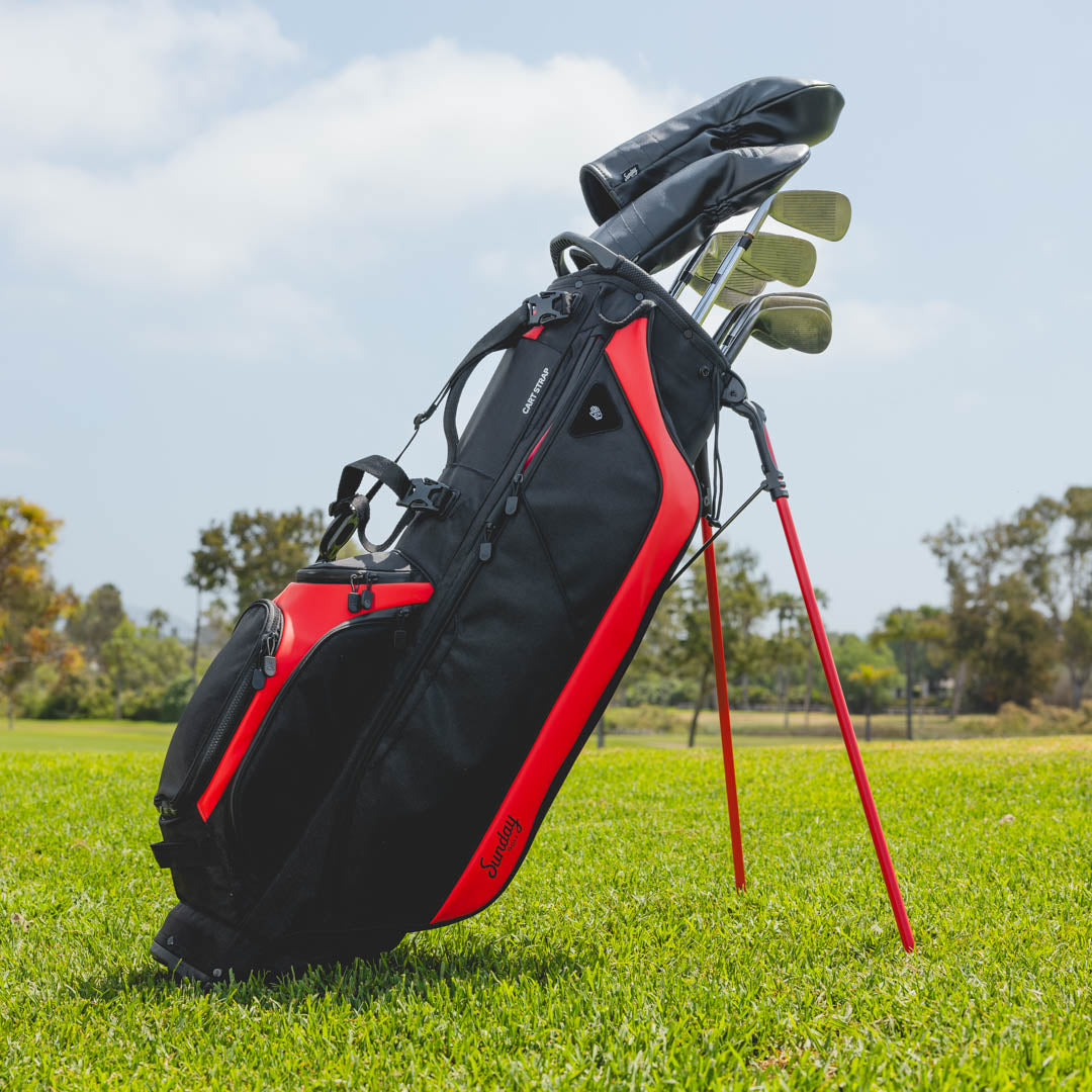 blackjack ryder golf bag with golf clubs on a grassy field