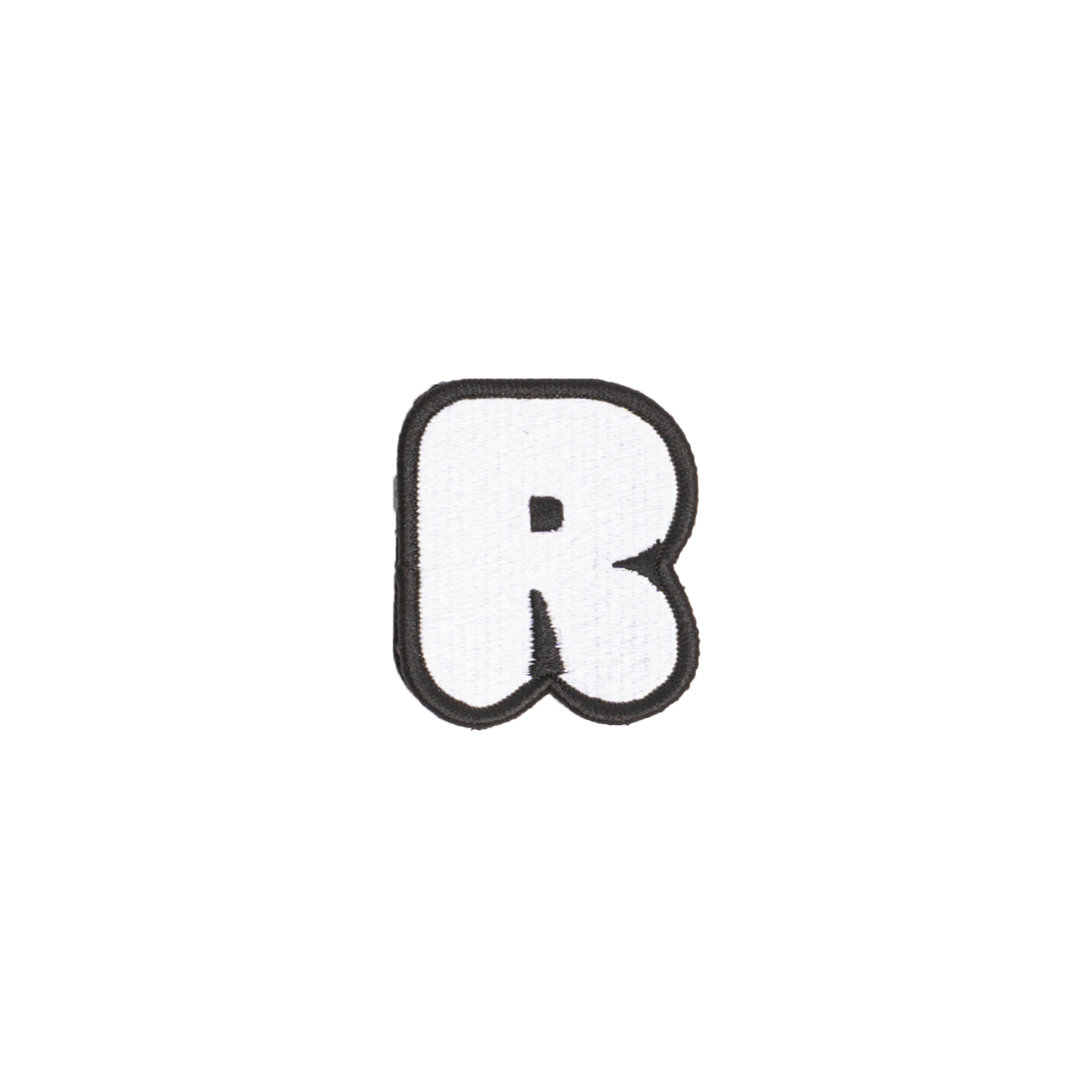 A white embroidered letter 'R' patch with a black border