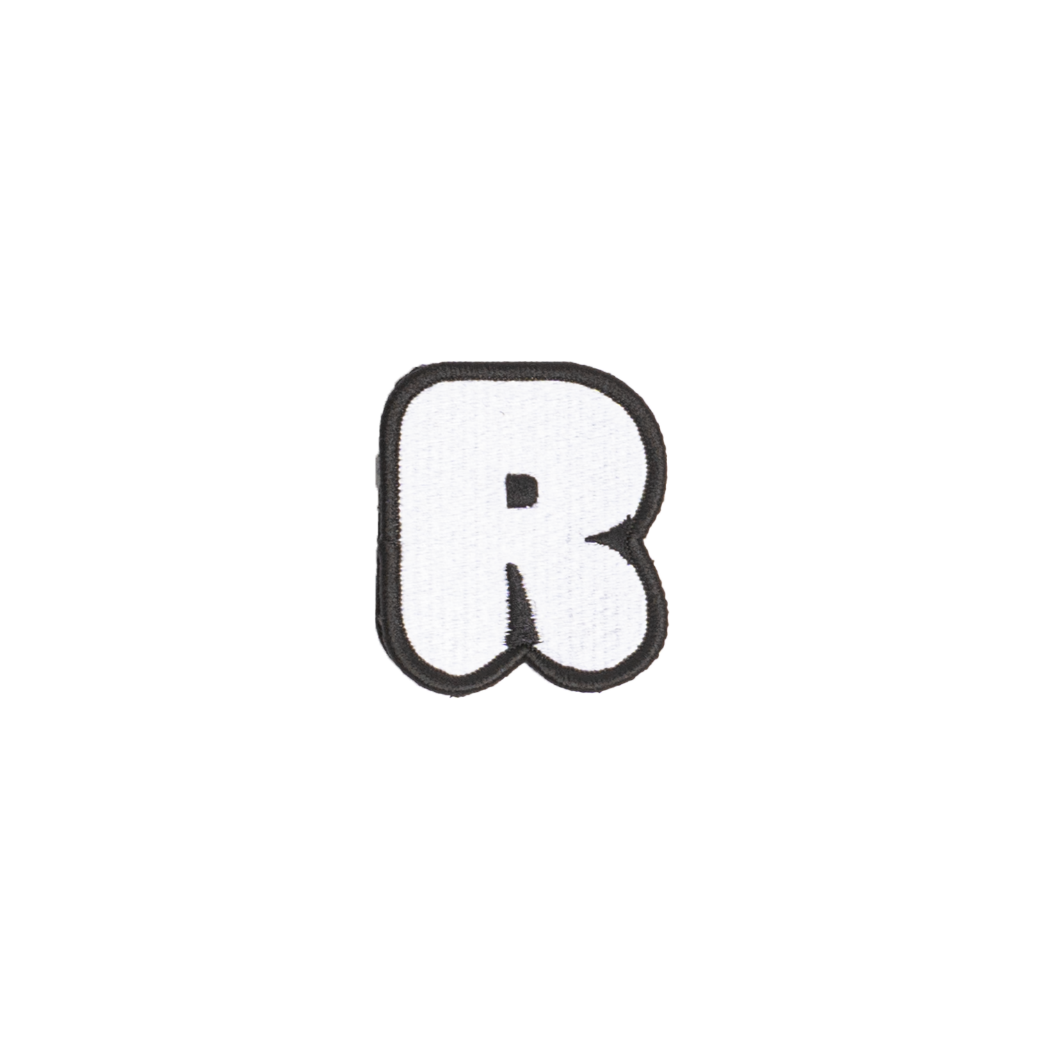 A white embroidered letter 'R' patch with a black border