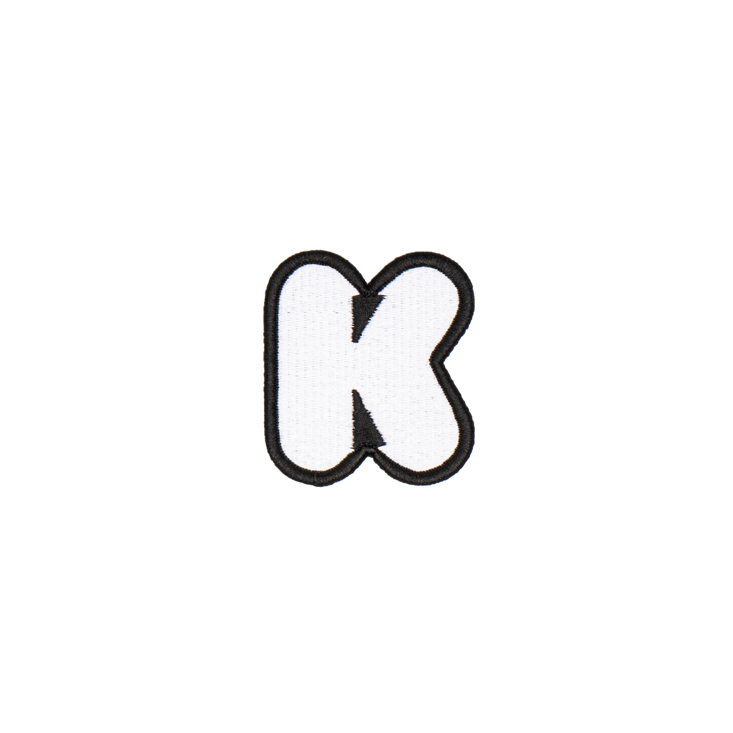 A white embroidered letter 'K' patch with a black border