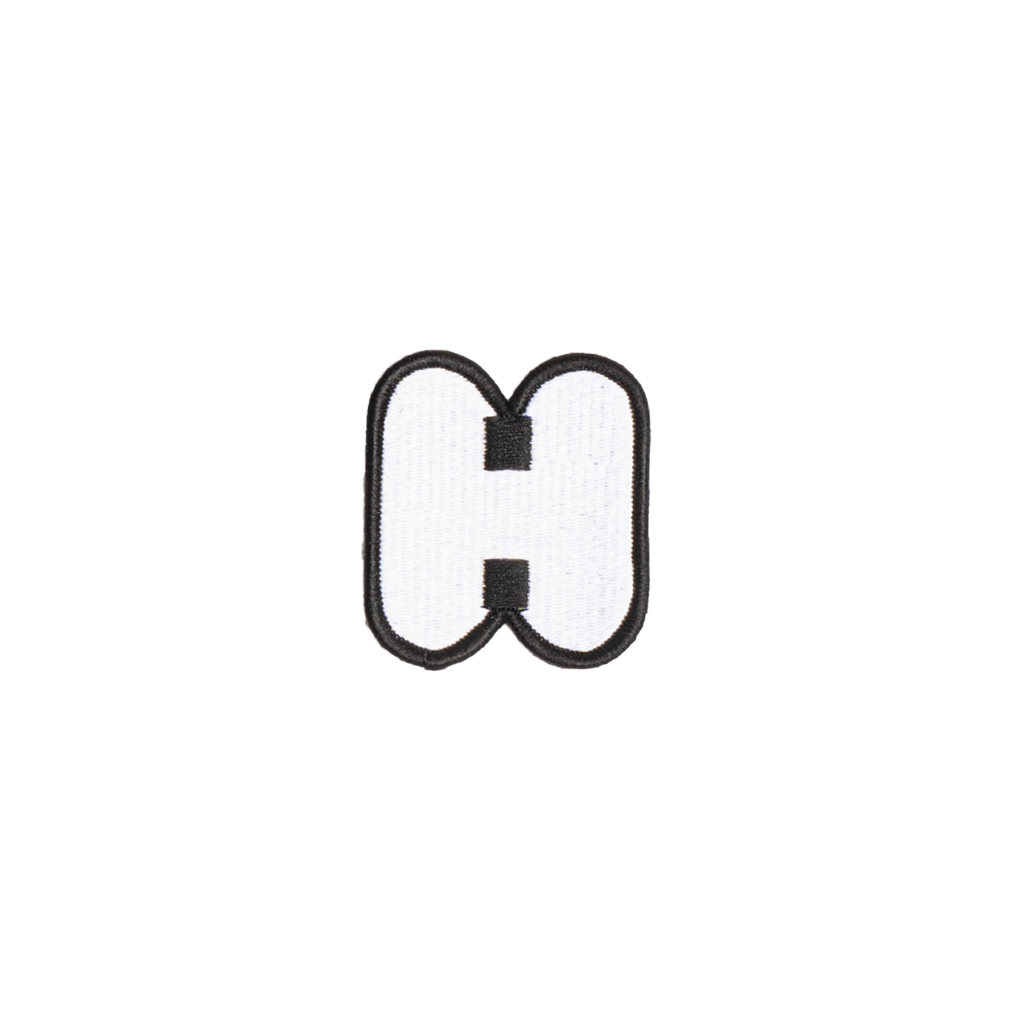A white embroidered letter 'H' patch with a black border