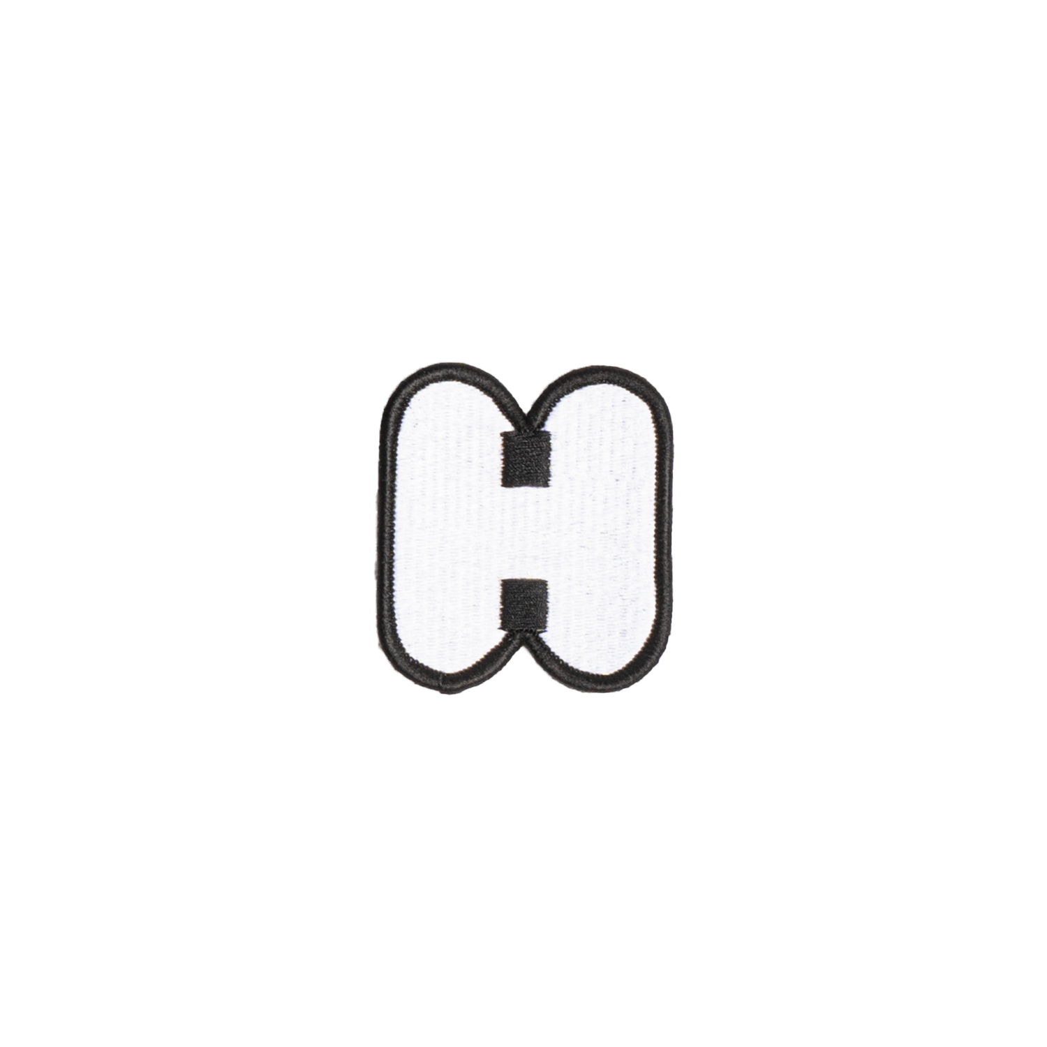 A white embroidered letter 'H' patch with a black border