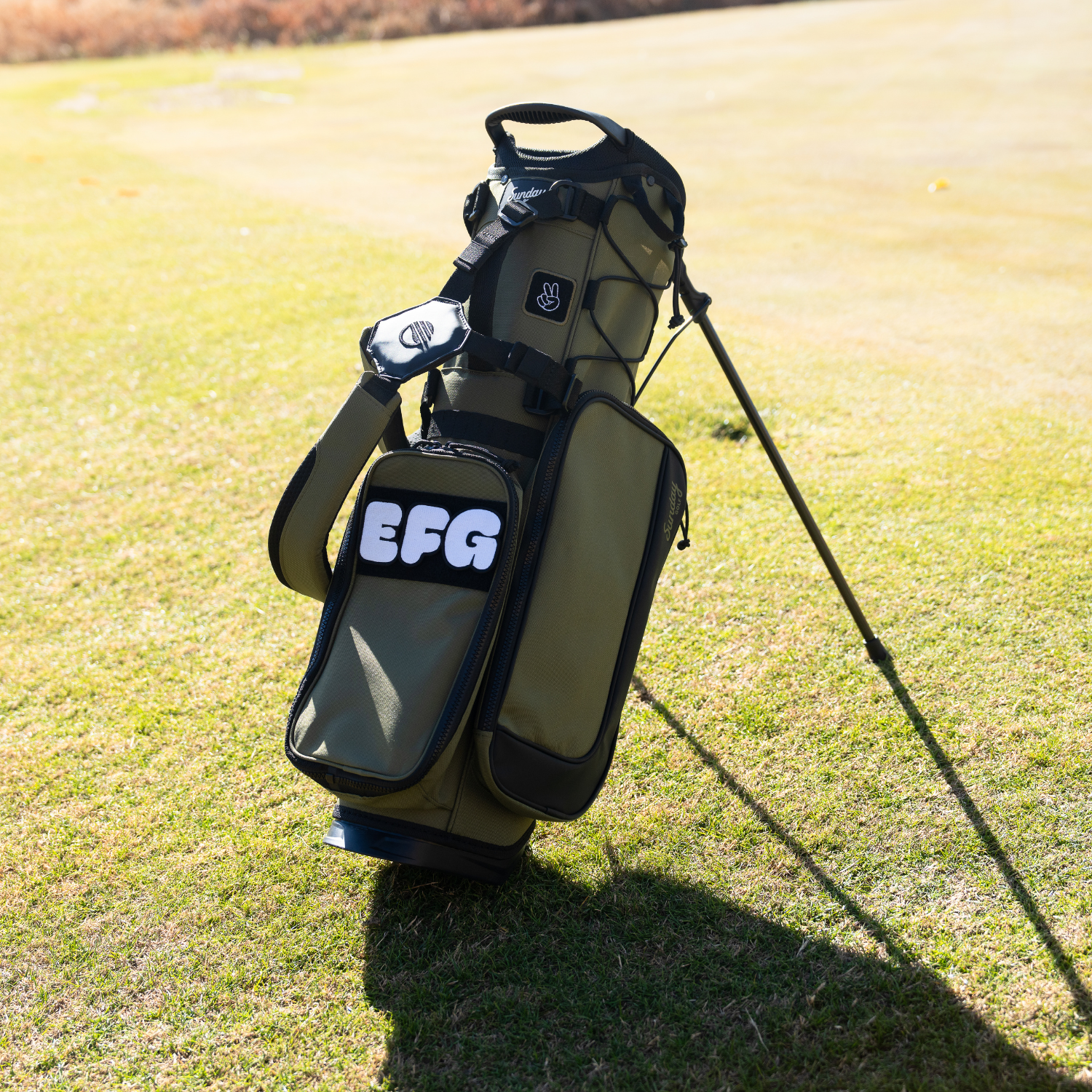 Sunday Golf's Olive Recess Kids Golf Bag, featuring 'EFG' patches and key design features.