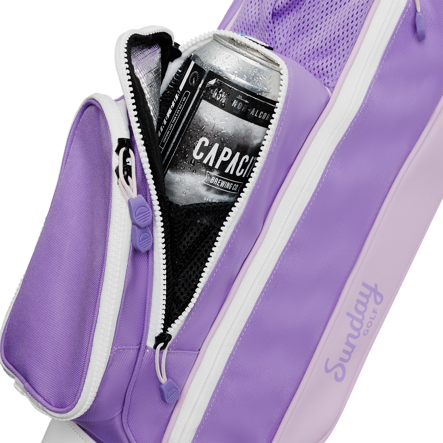 A close up shot of black vegan leather Loma golf bag's insulated pocket with a canned drink inside