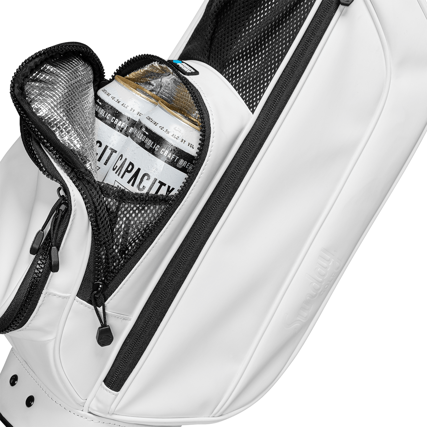 A close up shot of white vegan leather Loma XL S-Class golf bag's frosty pocket with canned drinks inside