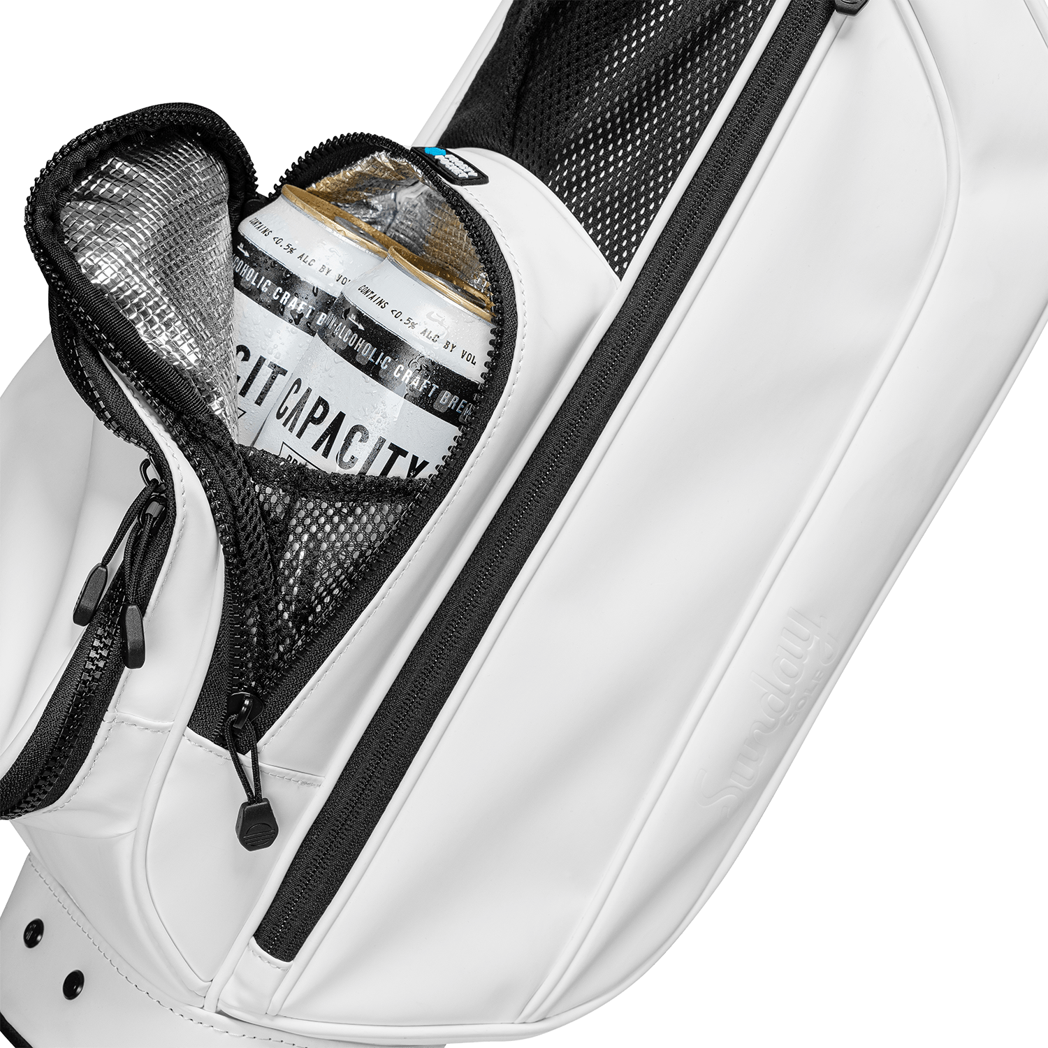A close up shot of white vegan leather Loma XL S-Class golf bag's frosty pocket with canned drinks inside