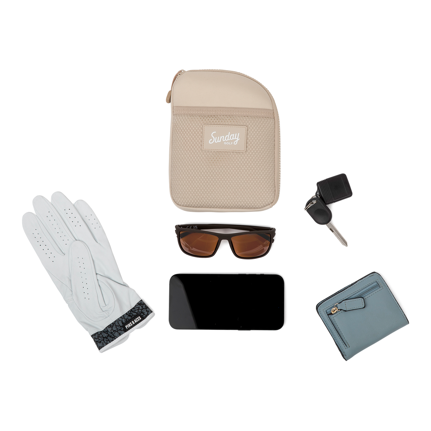 Toasted almond nickel bag valuables pouch laying flat with items it can hold