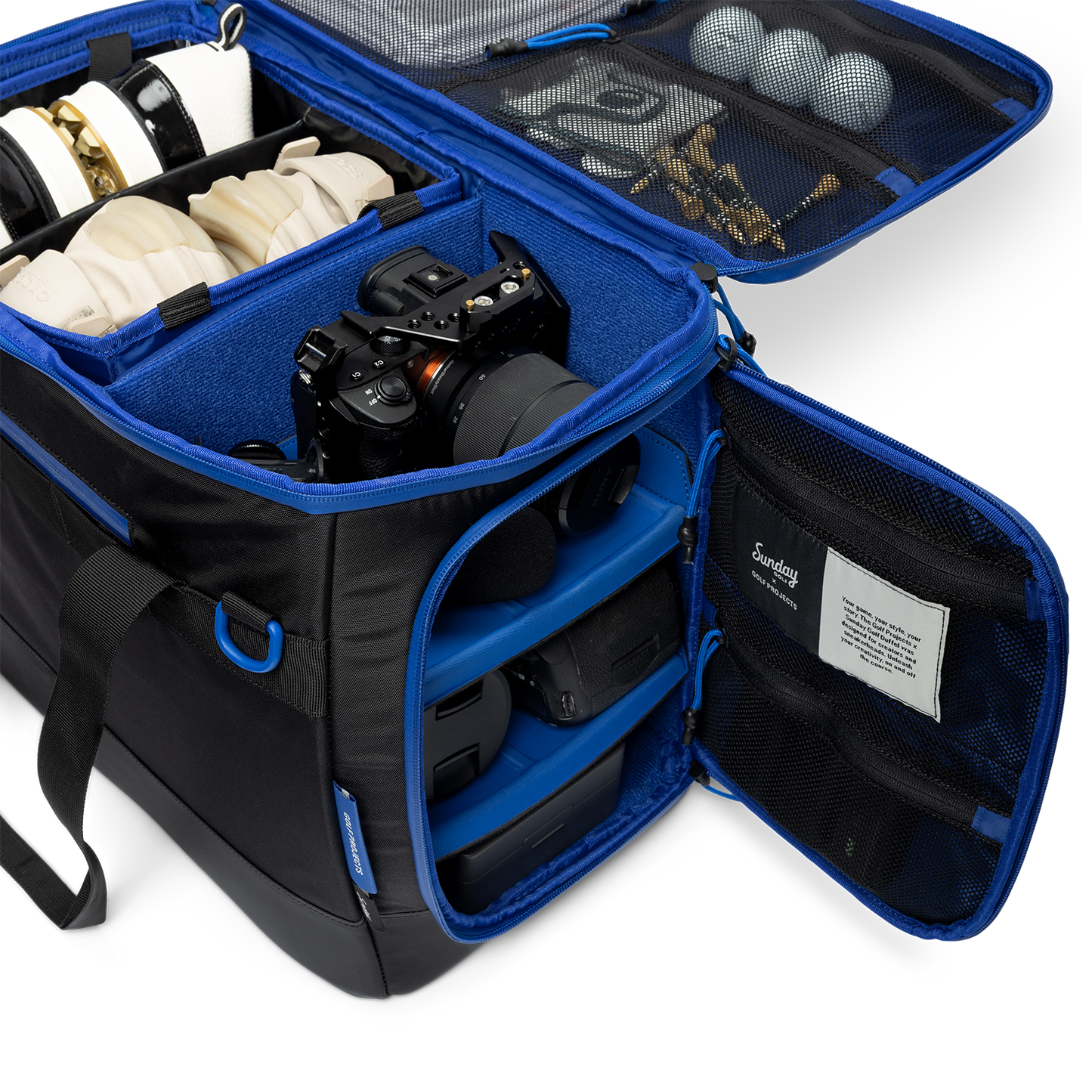 Sunday Golf's Creator Duffle Bag showcasing compartments containing camera equipment, accessories, and golf balls.
