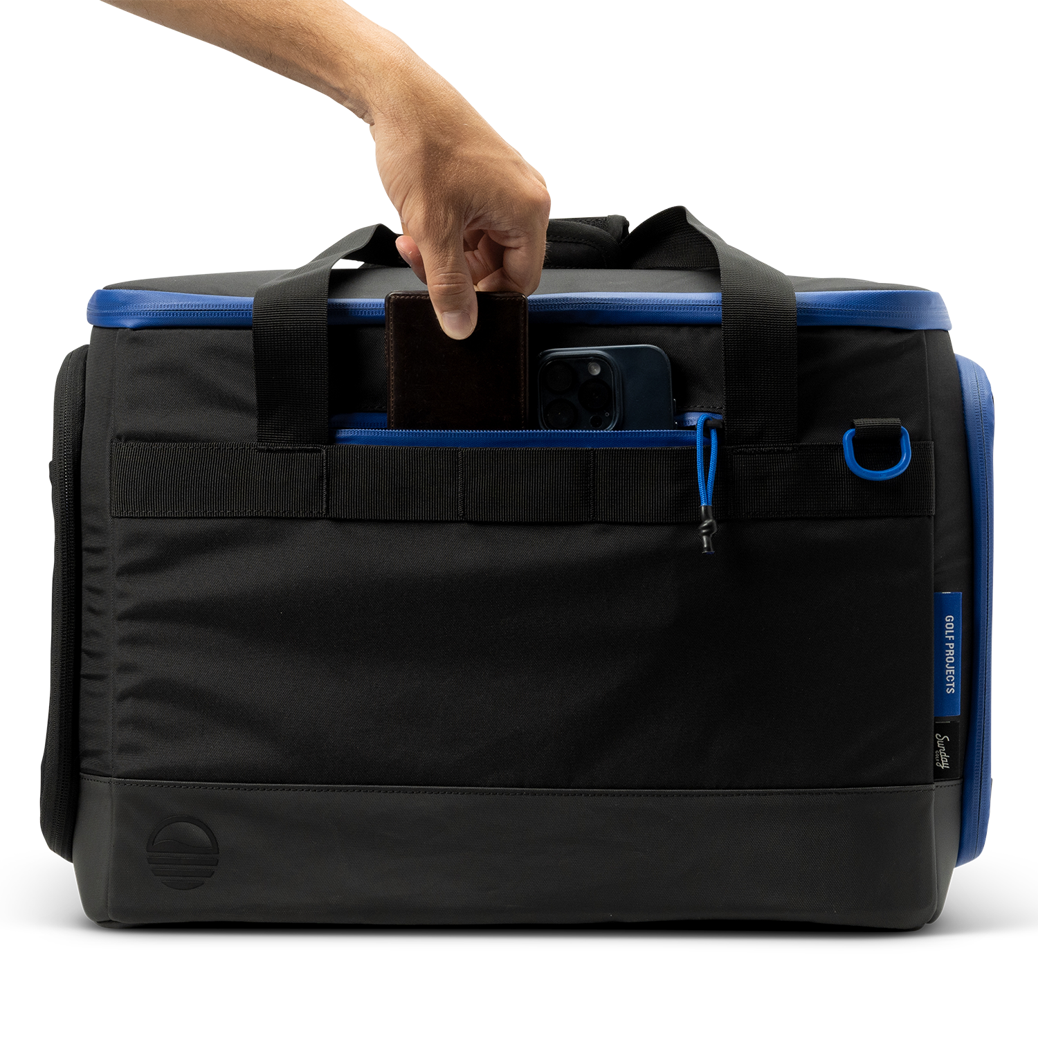 Sunday Golf's Creator Duffle Bag Blue  with a hand gripping the handle