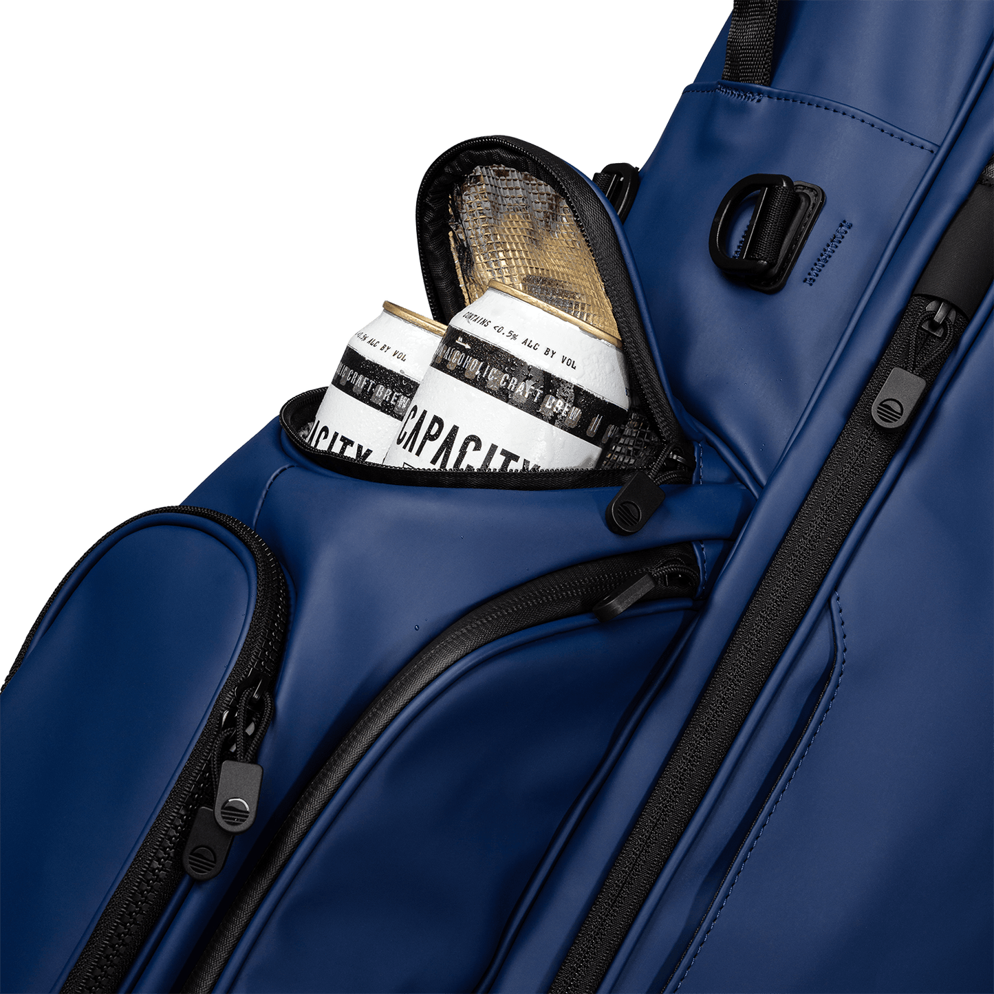 A close up shot of navy vegan leather Ryder S-Class golf bag's frosty pocket with canned drinks inside