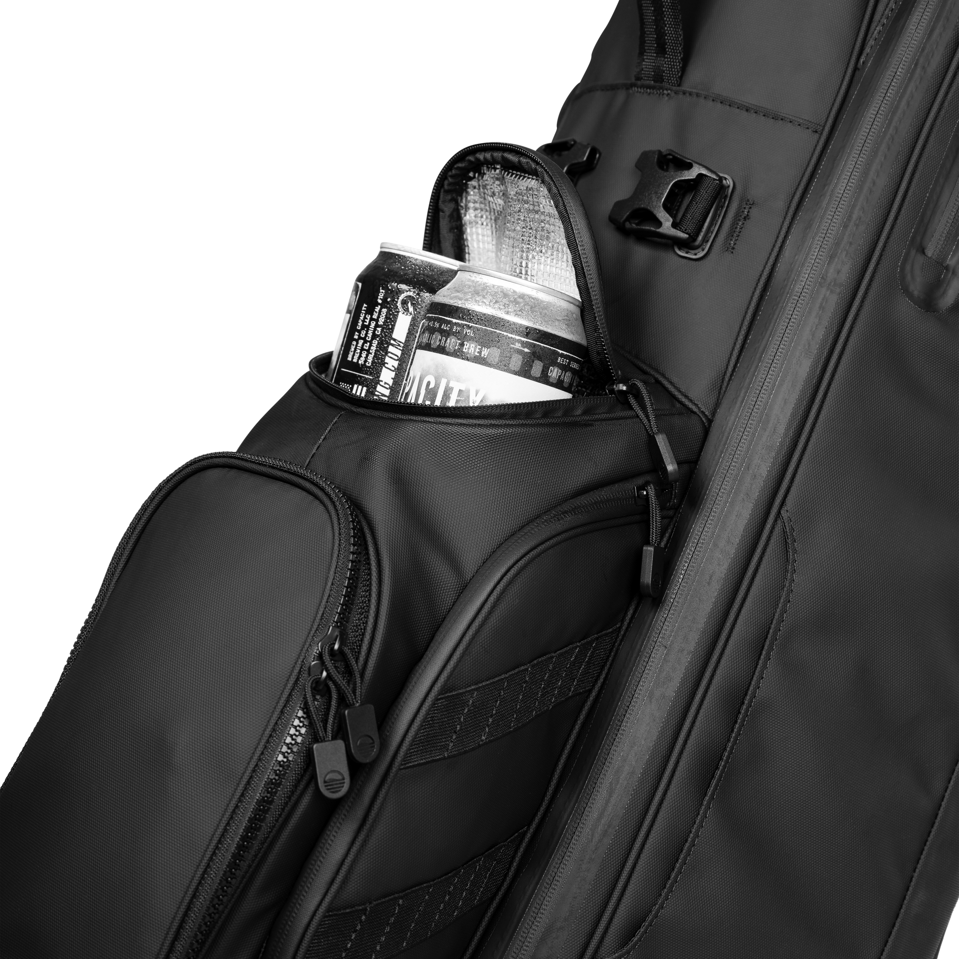 A close up shot of a Storm Ryder golf bag's frosty pocket with canned drinks inside