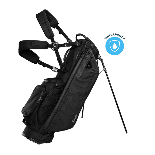 A full front shot of standing Storm Ryder golf bag in black with double strap