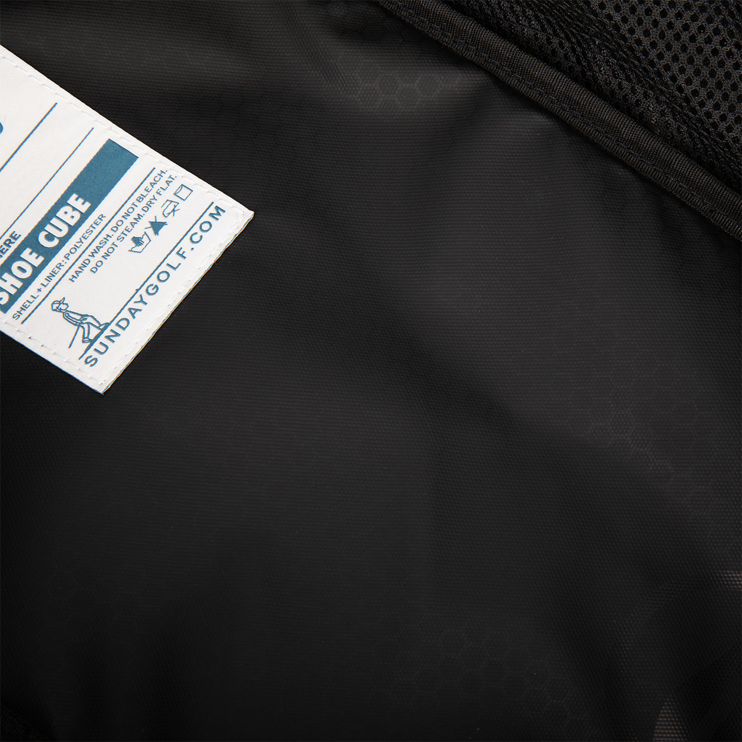 Close up shot of golf shoe travel bag showing Sunday Golf's tag
