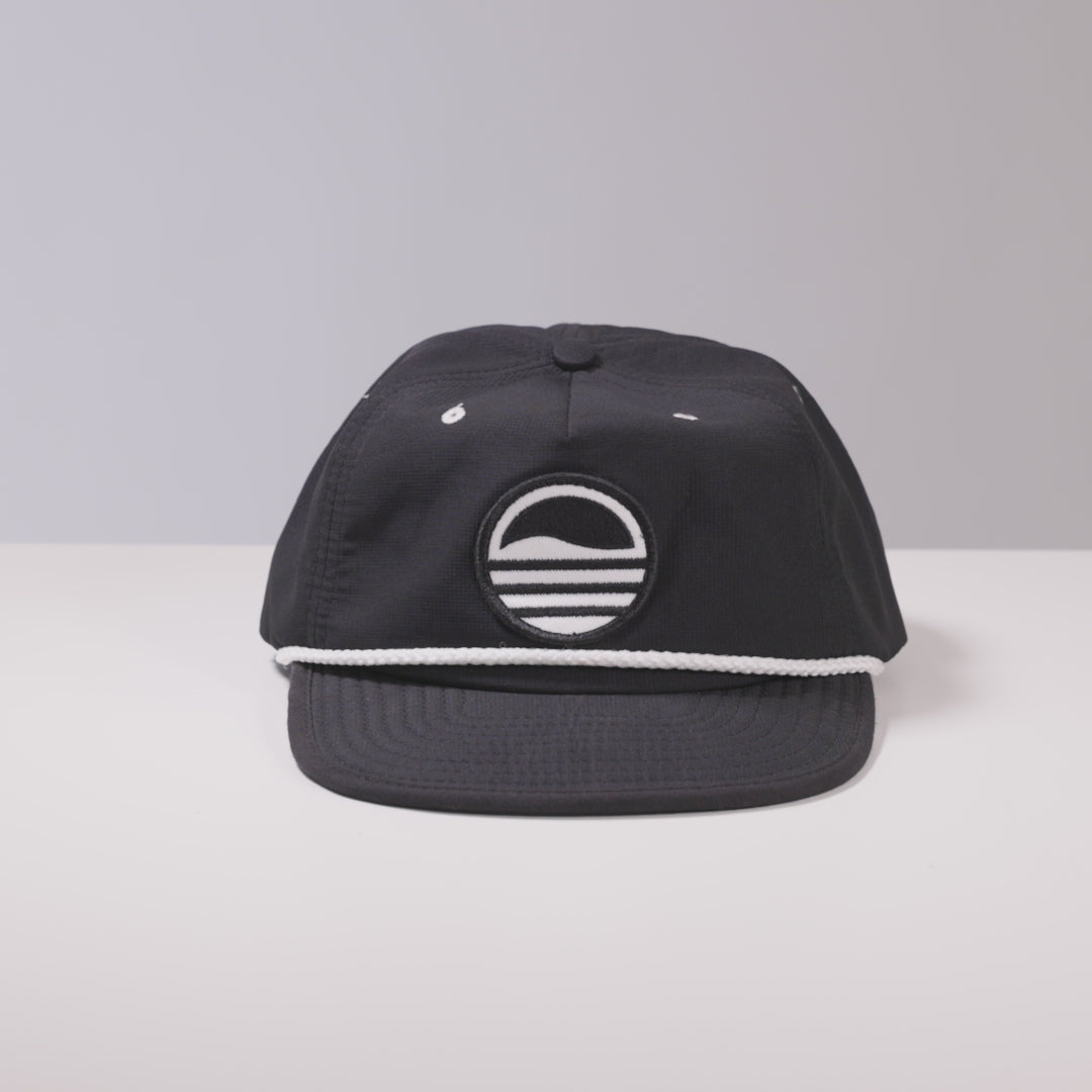 A gif of crushable hat by Sunday Golf  being crushed and bouncing back