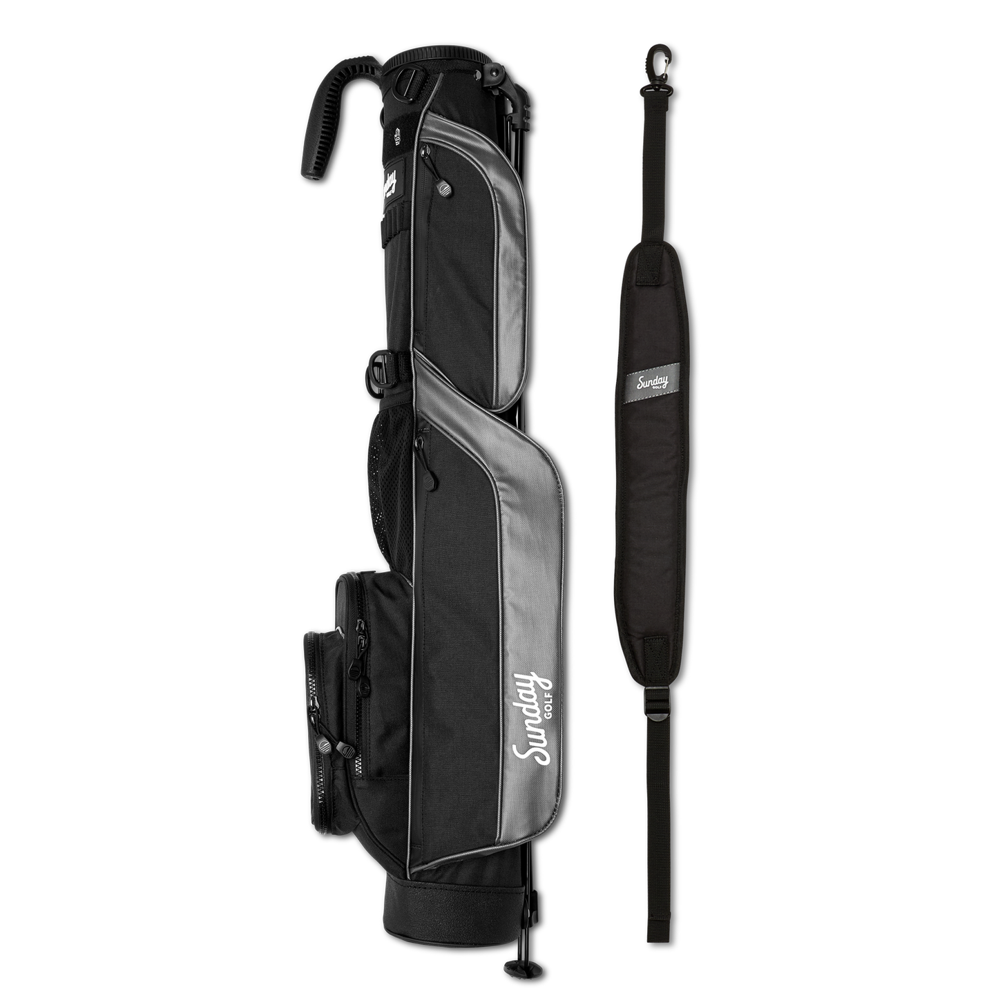 A full shot of Loma golf bag in matte black laying flat sideways beside its single strap
