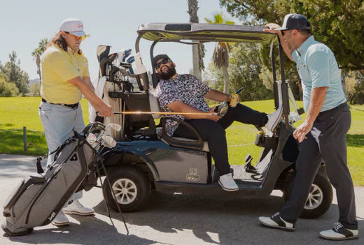men on golf course with the Sunday golf Loma bags