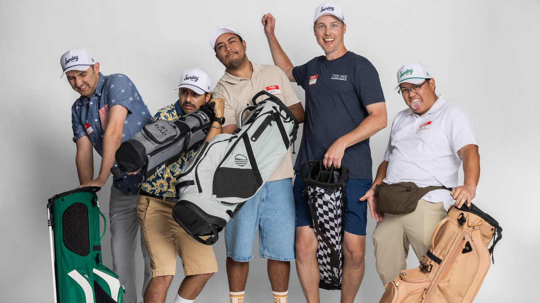 Five fathers wearing Sunday Golf hats pose playfully with various Sunday Golf bags and accessories