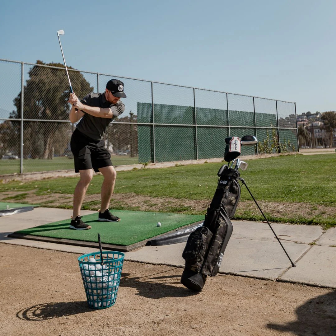 man at driving range