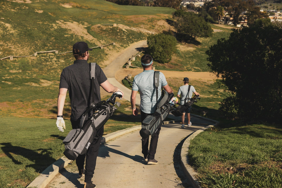 golf enthusiasts walking to the course with their Loma Sunday Golf bags