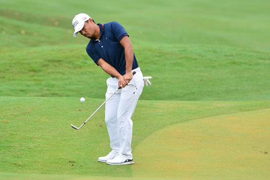 chipping golfer