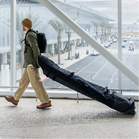 Person walking with roller bag