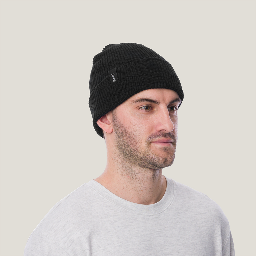 man wearing the black mickey beanie