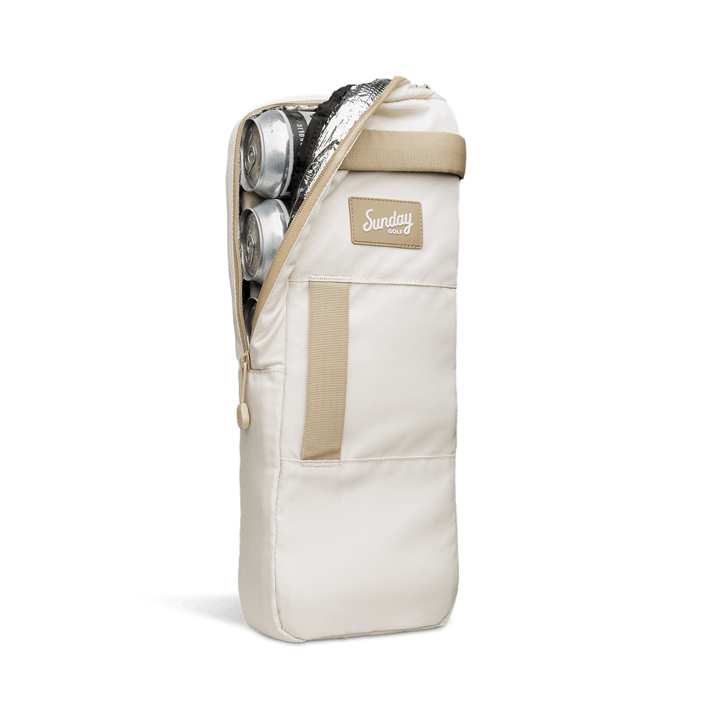 A front shot of big frosty golf cooler bag in toasted almond unzipped showing canned drinks inside