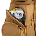 A close up shot of clay thompson Big Rig golf bag's frosty pocket with canned drinks inside
