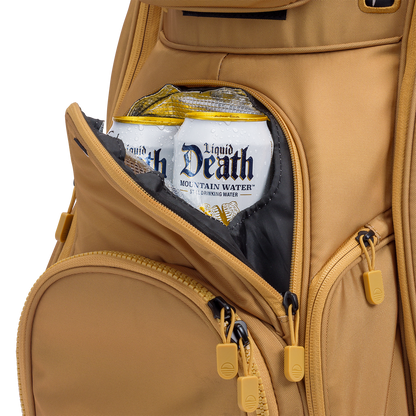 A close up shot of clay thompson Big Rig golf bag's frosty pocket with canned drinks inside
