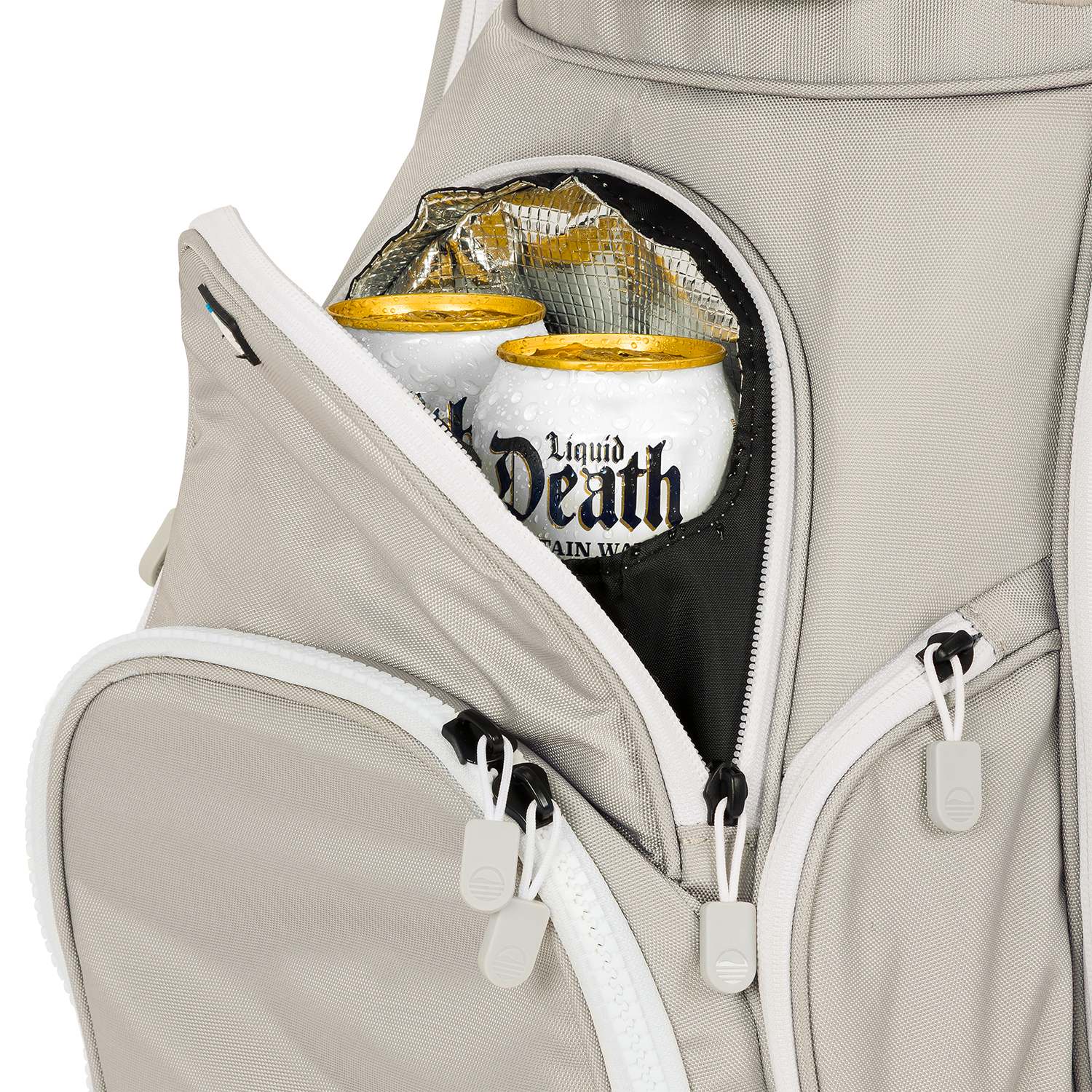 A close up shot of Cool Gray Big Rig golf bag's frosty pocket with canned drinks inside
