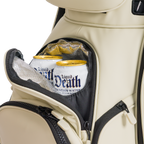 A close up shot of Cream Big Rig S-class golf bag's frosty pocket with canned drinks inside
