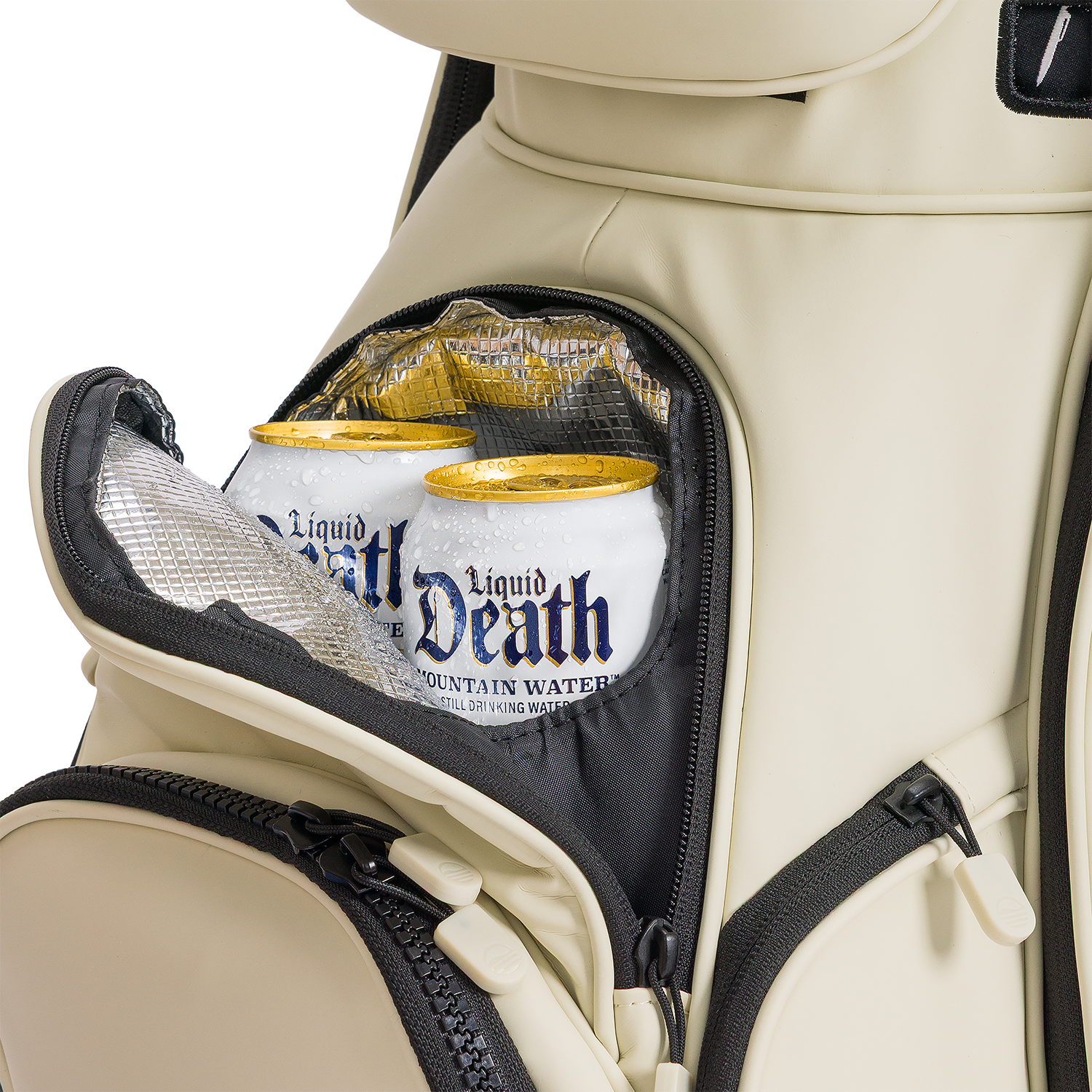 A close up shot of Cream Big Rig S-class golf bag's frosty pocket with canned drinks inside
