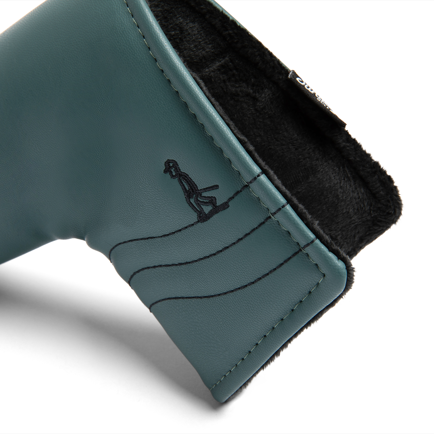Close up shot of blade putter golf headcover in midnight green vegan leather showing its linings