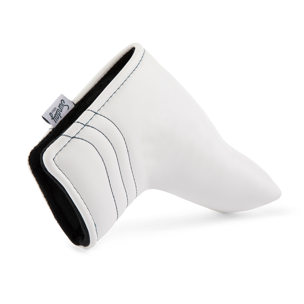 Close up shot of blade putter golf headcover in white/navy vegan leather showing its linings
