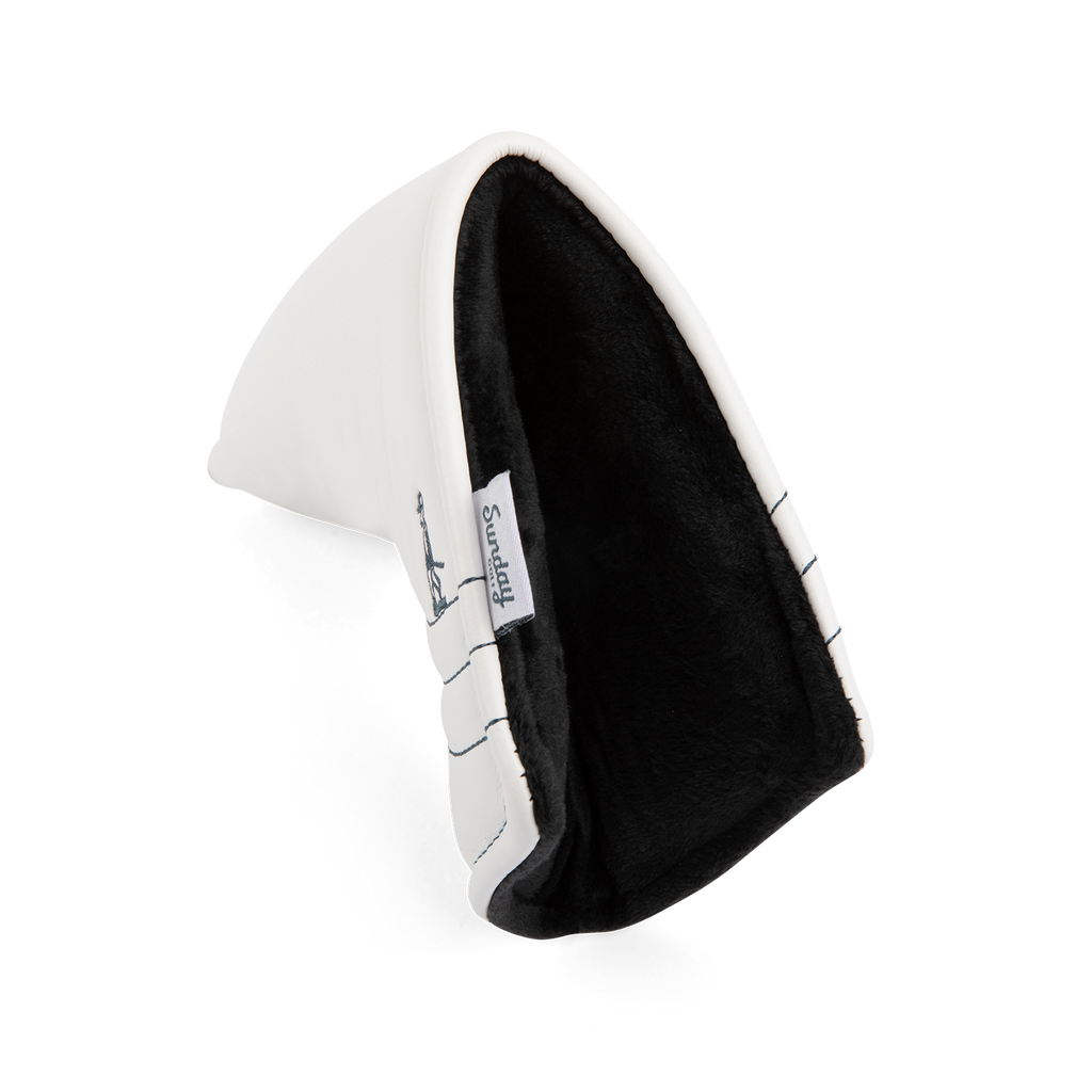 Side shot of blade putter golf headcover in white/navy vegan leather

