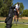 El Camino S-Class golf bag in vegan leather material on course with a man golfing at the background