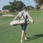 Person walking on a golf course carrying El Camino S-class golf bag in Cream
