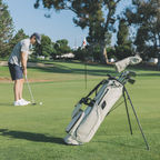 Golfer on a field with El Camino S-class golf bag in Cream