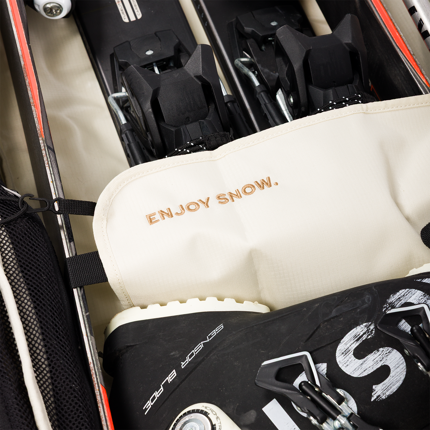 Closer look of the Drifter Snow Travel Bag's detail saying 'Enjoy Snow'