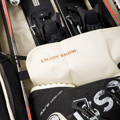 Closer look of the Drifter Snow Travel Bag's detail saying 'Enjoy Snow'