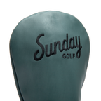Close up shot of driver golf headcover in midnight green vegan leather showing its material and Sunday Golf logo
