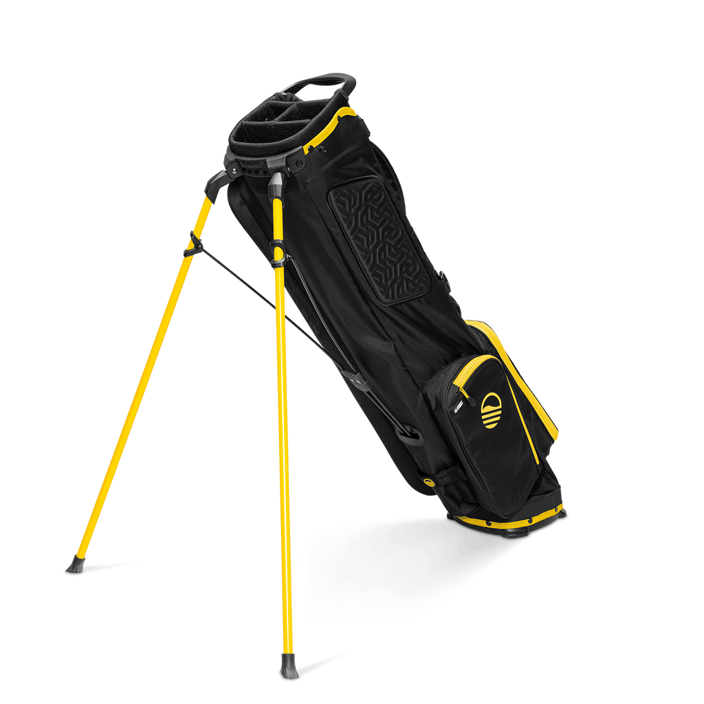 A full shot of El Camino golf bag in black and yellow facing backward