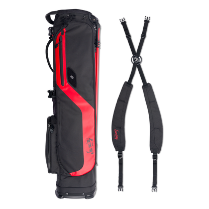 A full shot of El Camino golf bag in blackjack laying flat sideways beside its double strap 
