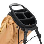 Close-up of a golf bag with a black stand and handle on a white background