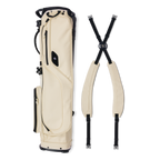 A full shot of El Camino S-class golf bag in Cream laying flat sideways beside its double strap 
